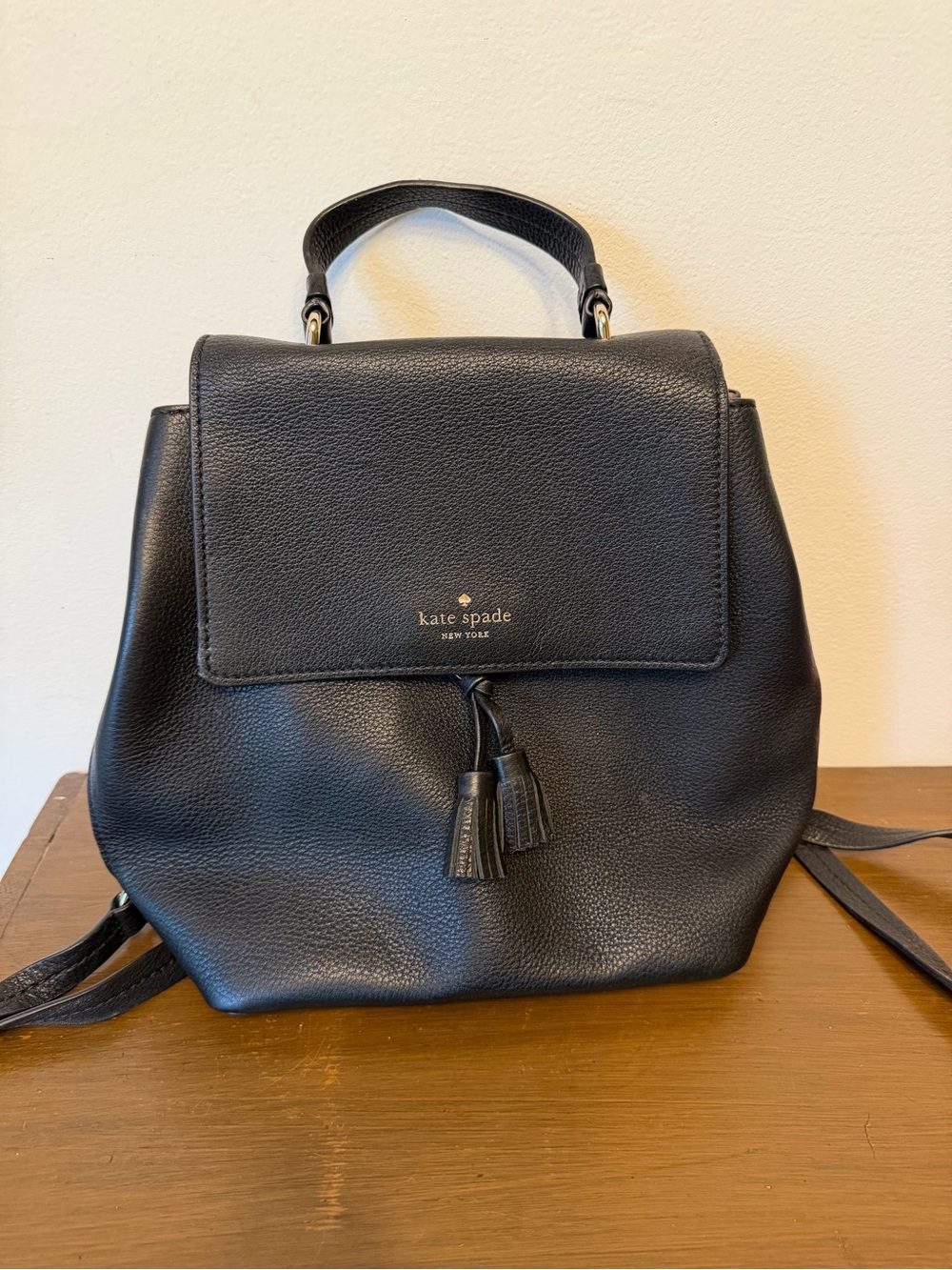 kate spade Black Pebbled Leather Backpack with Tassel